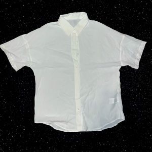 Casual white button up; Great for the work environment; Can dress it up or down